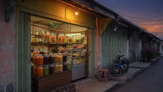 Editorial Johor shopfront dusk. Digital HQ original atmosphere.