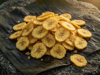 Editorial banana-chip still. Digital HQ original.