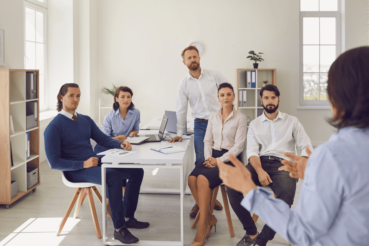 Office meeting visual on the VISION page.