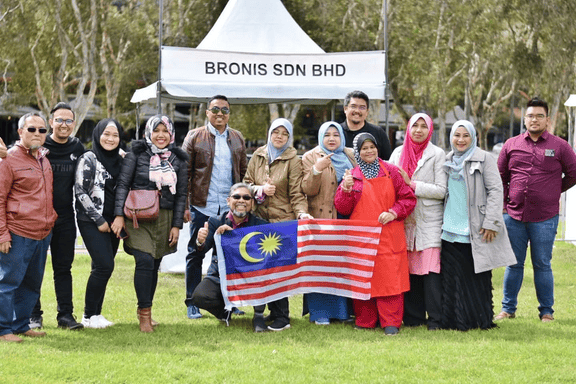 Overseas delegation and visit photo on the EXHIBITION PARTICIPATION page.