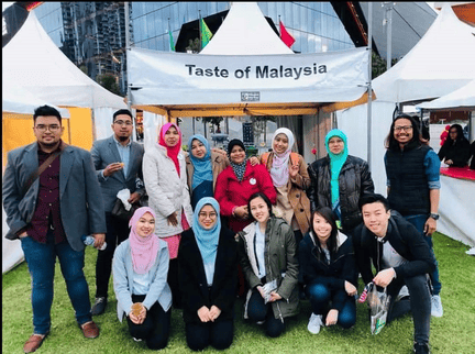 Group photo at the “Taste of Malaysia” booth on the EXHIBITION PARTICIPATION page.