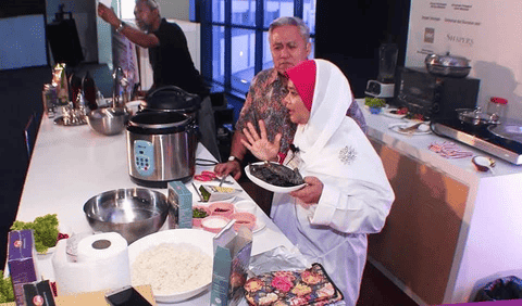 Culinary demonstration at an overseas exhibition or event.