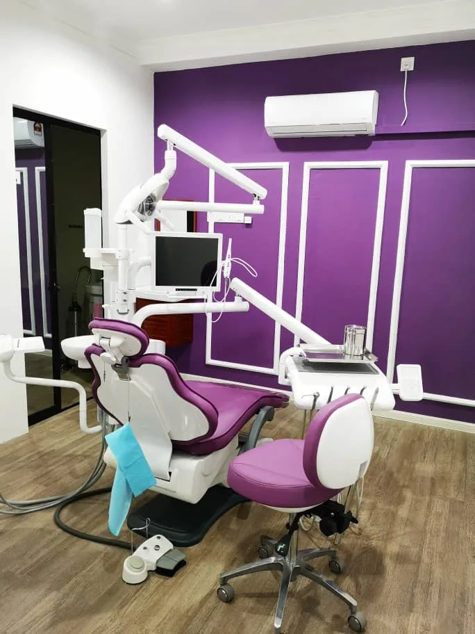 Dr Feeliz treatment room with purple branded interior